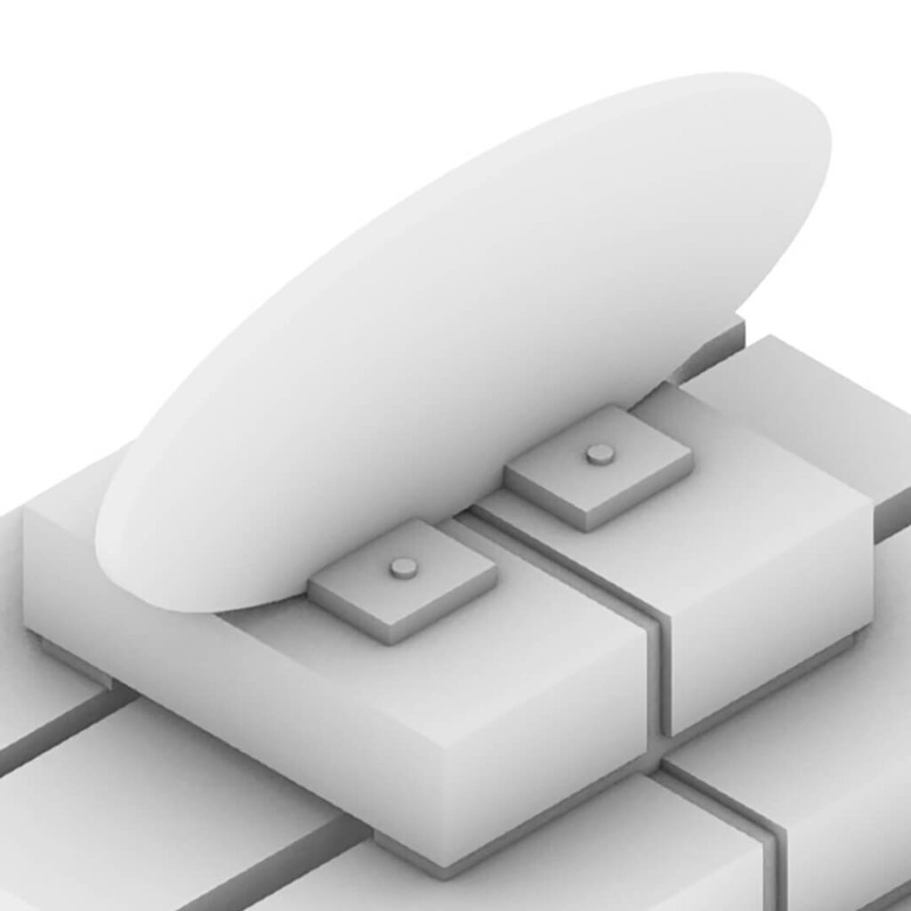 Concept image of the artwork. An oval white object is attached on top of white bricks.